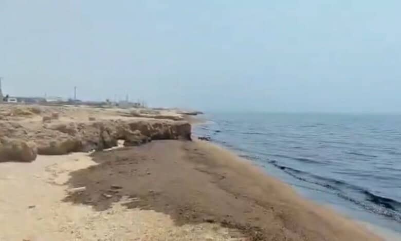 Oil spill on a beach in Oman