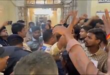 Police officials prevent students from entering the principal's chamber at Nizam College