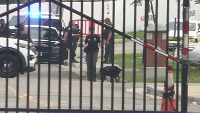 Police and emergency responders at Virginia State University campus after shooting incident.