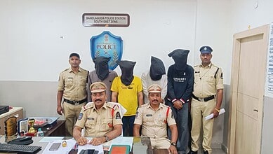 Police officers with detained suspects at Bandlaguda Police Station in Hyderabad.