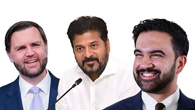 Three men in formal attire smiling during a meeting or event.