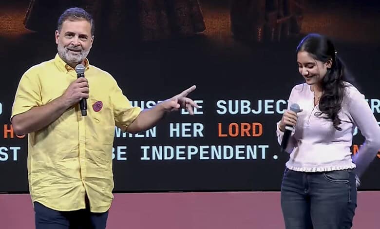 Rahul Gandhi and a woman speaking on stage during a public event.