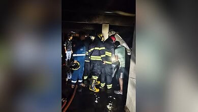 Fire officials rescue residents in Film Nagar after a fire accident