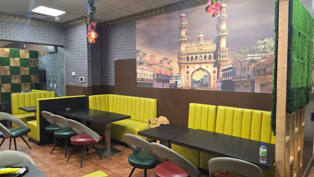 Interior of Toronto's Biryani Spot with vibrant decor and seating area.