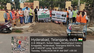Group of Hyderabad officials and workers during sanitation and pothole repair work.