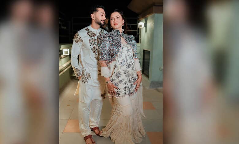 Gauahar Khan and Zaid Darbar posing together at a public event.
