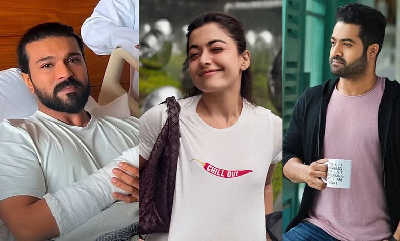 Three young adults outdoors, smiling and relaxed, in casual attire.