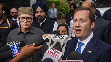 US envoy speaking to media about J&K travel advisory amid security improvements.