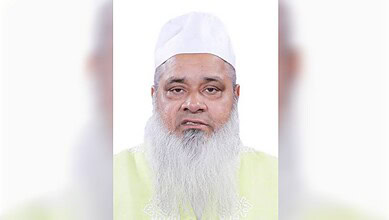 Portrait of a religious leader with a white cap and long white beard.