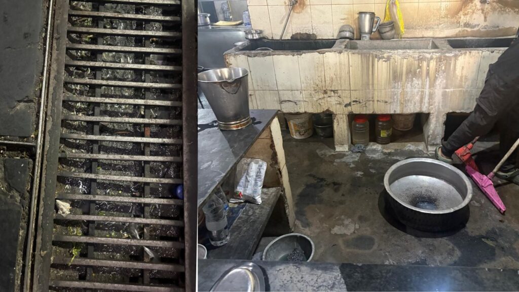Dirty kitchen with greasy stove and utensils in a restaurant kitchen.