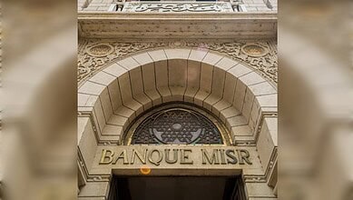 Close-up of Banque Misr's entrance with detailed architectural carvings and signage.