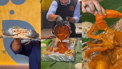 Person holding a fresh lobster at Hyderabad's first seafood bucket experience event.