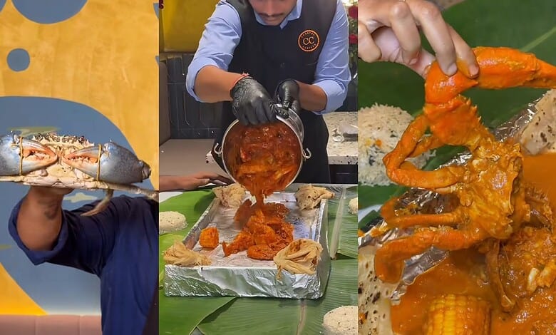 Person holding a fresh lobster at Hyderabad's first seafood bucket experience event.