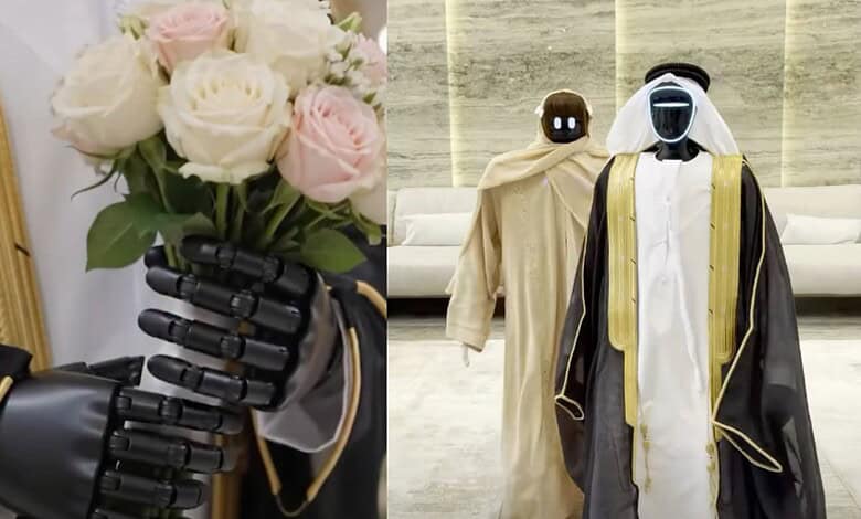 Two humanoid robots dressed in traditional Middle Eastern clothing at a Dubai event.