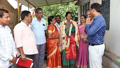 Officials and teachers discuss school development in Khammam, Telangana.