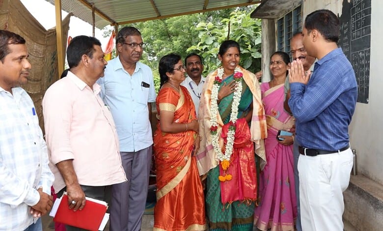 Officials and teachers discuss school development in Khammam, Telangana.