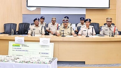 Police officials display recovered Rs 1 crore cyber fraud money in Hyderabad.