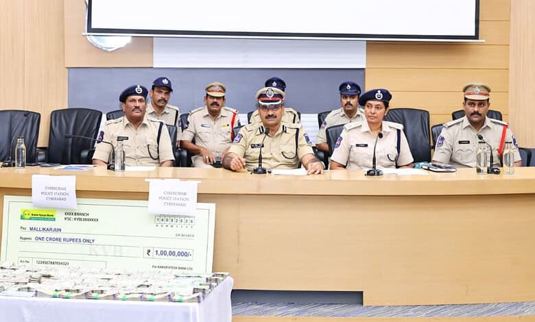 Police officials display recovered Rs 1 crore cyber fraud money in Hyderabad.
