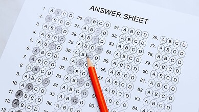 OMR sheet with a red pencil