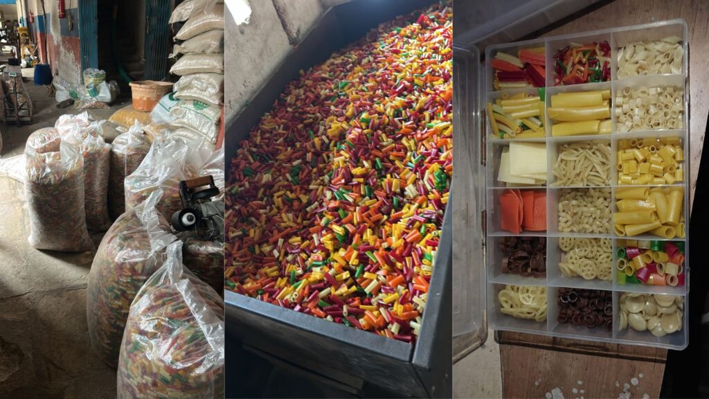 Assorted food ingredients including candies, pasta, and spices in a market setting.
