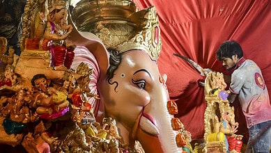 Large Ganesha idol being decorated during Ganesh Chaturthi celebrations in Hyderabad's Dhoolpet.