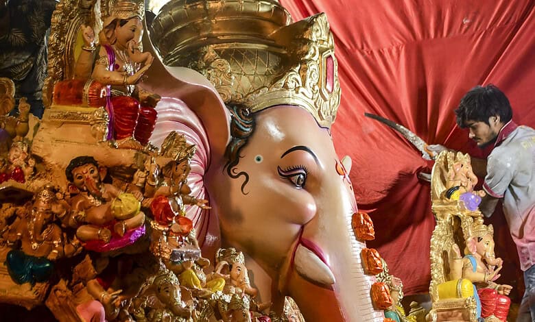Large Ganesha idol being decorated during Ganesh Chaturthi celebrations in Hyderabad's Dhoolpet.