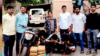 Police officers and suspects with seized drugs in Hyderabad, India.