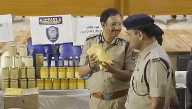 Police officers inspecting adulterated ghee in Hyderabad crackdown, seized 36 tonnes.