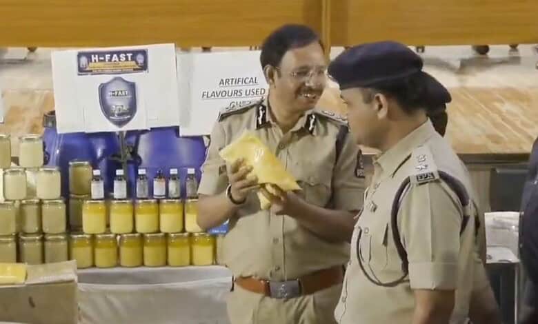Police officers inspecting adulterated ghee in Hyderabad crackdown, seized 36 tonnes.