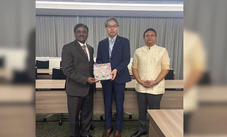 Three men in formal attire at a partnership event with Japan Institution for Young India Skills.