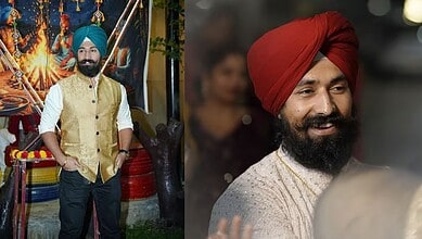Sikh man wearing a red turban and beige kurta smiling at a celebration event.
