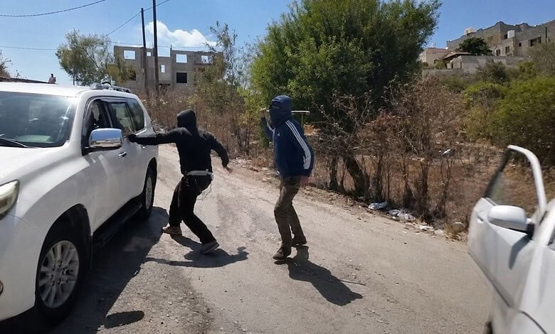 Masked Israeli settlers attack an NBC News crew and a Palestinian woman in Jalud, occupied West Bank.