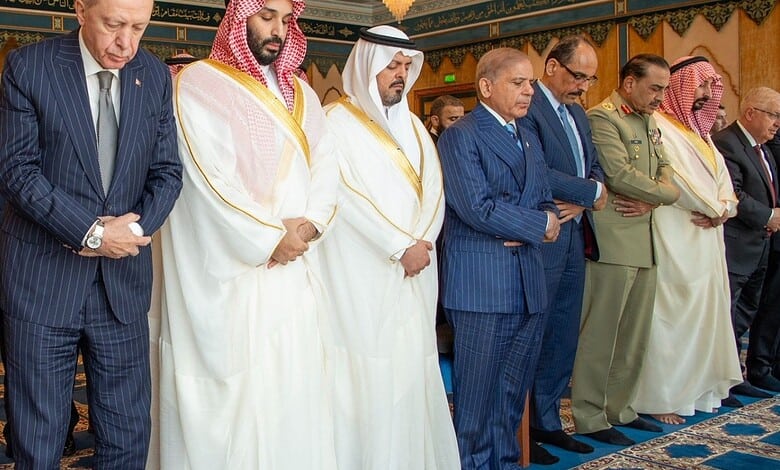 World leaders praying together in Makkah during a religious gathering.