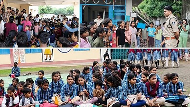 Children protesting school mergers in Madhya Pradesh with teachers and officials present.