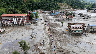 People move to a safer place after flash floods, in Devighat Bidur Municipality area, Nuwakot, Nepal, Thursday, Aug. 27, 2026. The death toll from the devastating flash floods surged to 359 on Thursday. (PTI Photo/Abhishek Maharjan)