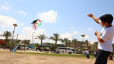 Palestinian child flying a kite in Gaza.