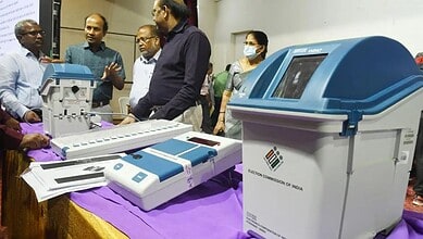 Electoral voting machines displayed at Telangana polling station for election process.