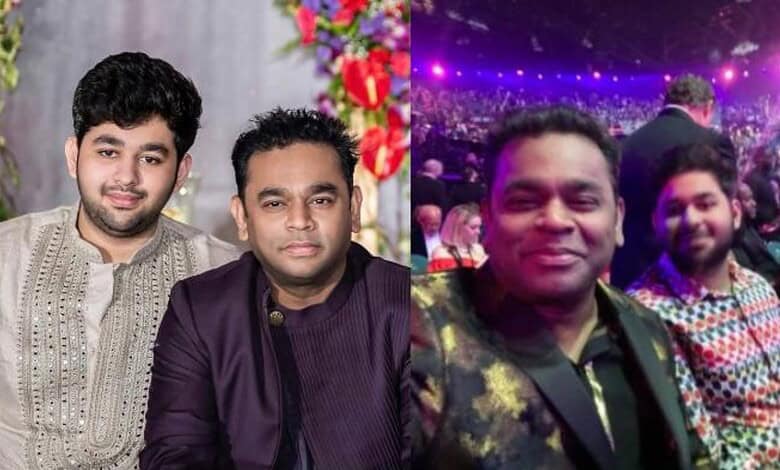 Three men at a celebration event, with one in traditional attire and others in casual wear, in a festive,.