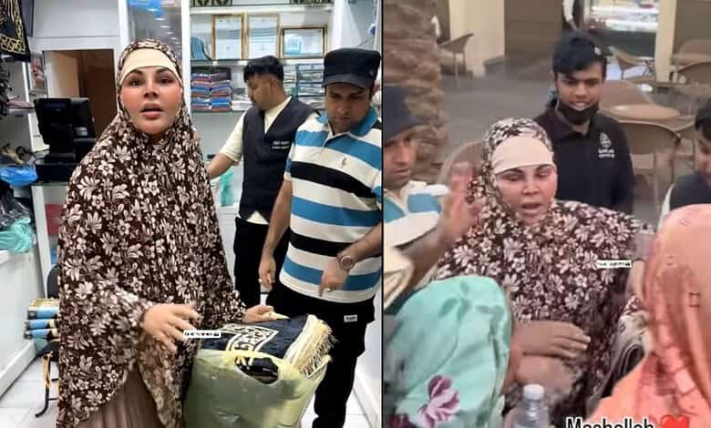 Rakhi Sawant in Makkah distributing jaananamaz, surrounded by fans and media.