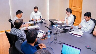 Revanth leads a meeting on Hyderabad roads with officials and team members.