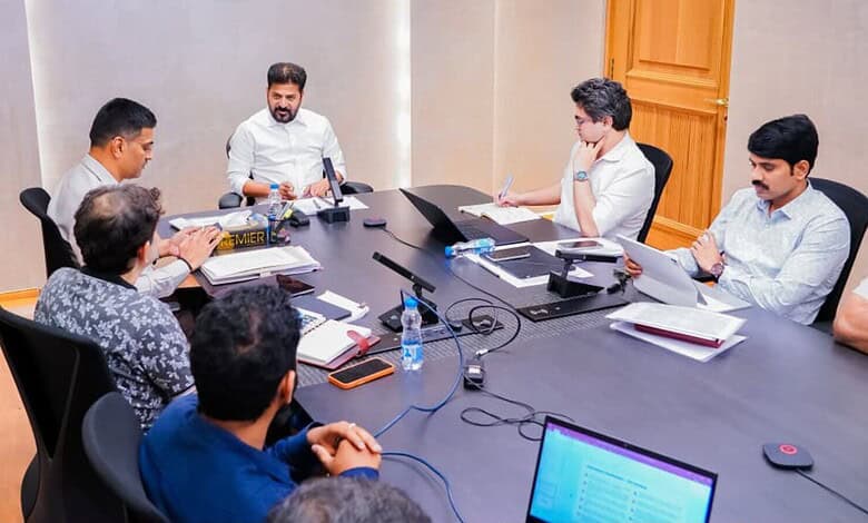 Revanth leads a meeting on Hyderabad roads with officials and team members.