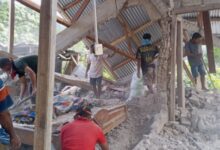 People clear up the rubble from a house damaged in an earthquake in East Manggarai, East Nusa Tenggara province, Indonesia, Saturday, Aug. 15, 2026. (AP/PTI)