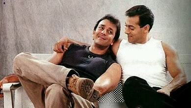 Salman Khan and Sanjay Dutt sitting together, smiling and sharing a moment of friendship.