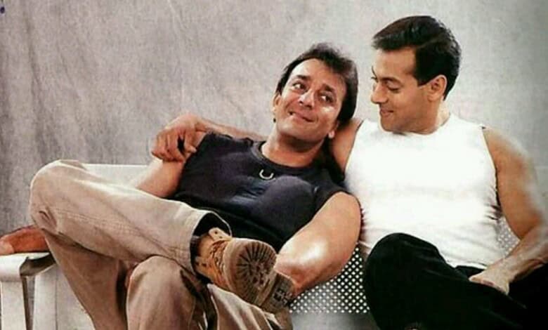 Salman Khan and Sanjay Dutt sitting together, smiling and sharing a moment of friendship.