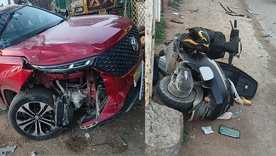A mangled car and bike after acident in Bandlaguda