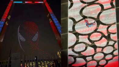 Spider-Man descends Dubai Frame as drones form his mask in the sky.