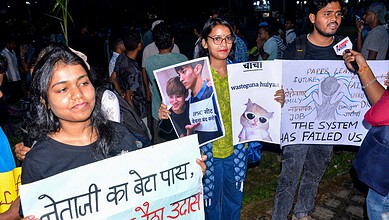 Protesters holding signs during hunger strike in Jharkhand, India.