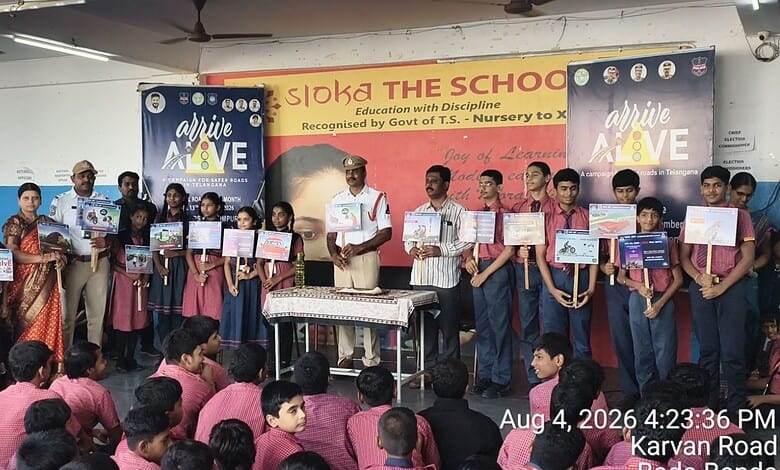 Students and police officers participate in a road safety awareness session at The Siasat Daily event.