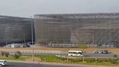 Large protective cages surround fuel tanks to defend against drone attacks in the UAE.