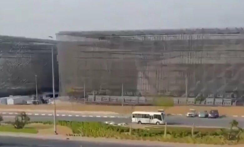 Large protective cages surround fuel tanks to defend against drone attacks in the UAE.